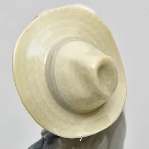 Коллекционная Фарфоровая статуэтка «Продавец фарфора»,  Lladro Испания - 1974 год.