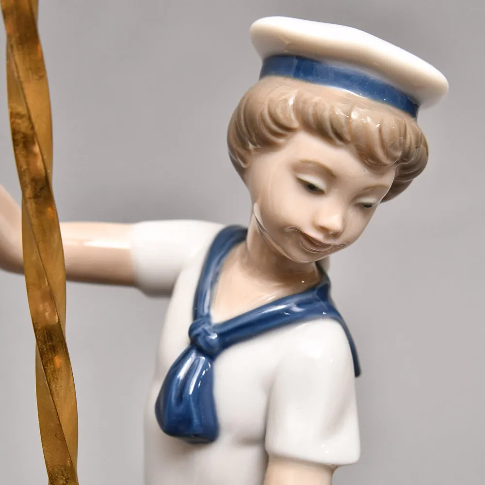 Коллекционная Фарфоровая статуэтка «Мальчик в матроске на карусельной лошадке», Lladro Испания. 