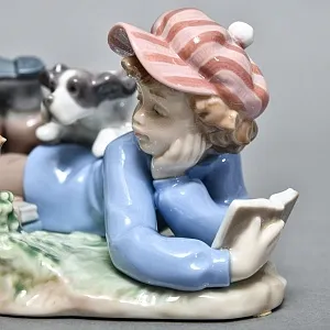 Коллекционная Фарфоровая статуэтка «Мальчик с собакой и птицей», Lladro Испания. 