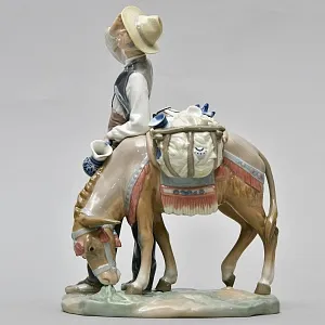 Коллекционная Фарфоровая статуэтка «Продавец фарфора»,  Lladro Испания - 1974 год.