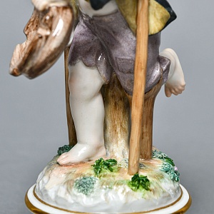Антикварная Фарфоровая статуэтка «Купидон в образе нищего», Meissen Германия, начало ХХ века. 